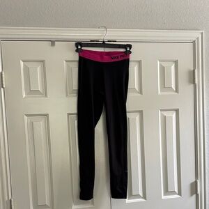 Nike Black and Pink Athletic Leggings with Form-Fitting Design